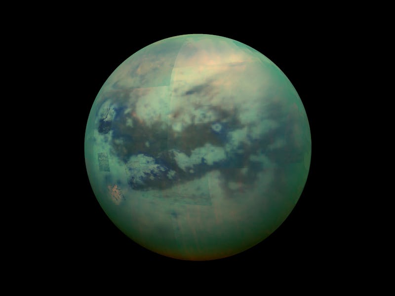 Titan, Saturn's largest moon with darkness all around it