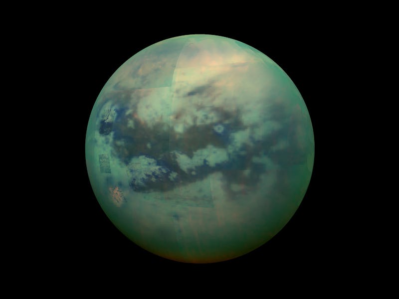 Titan, Saturn's largest moon with darkness all around it 