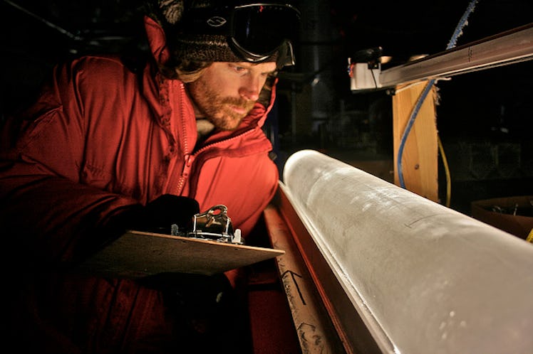 A man looking at an ice core 