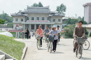 Older people riding bicycles in Pyongyang