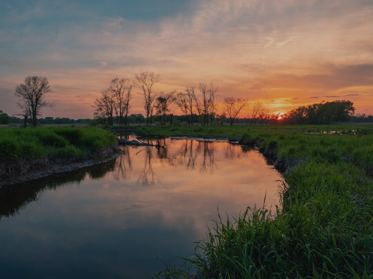 A landscape view of a river and a sunset in New Jersey