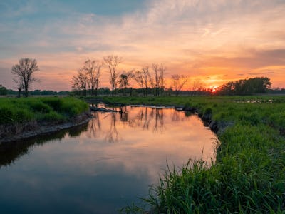 A landscape view of a river and a sunset in New Jersey