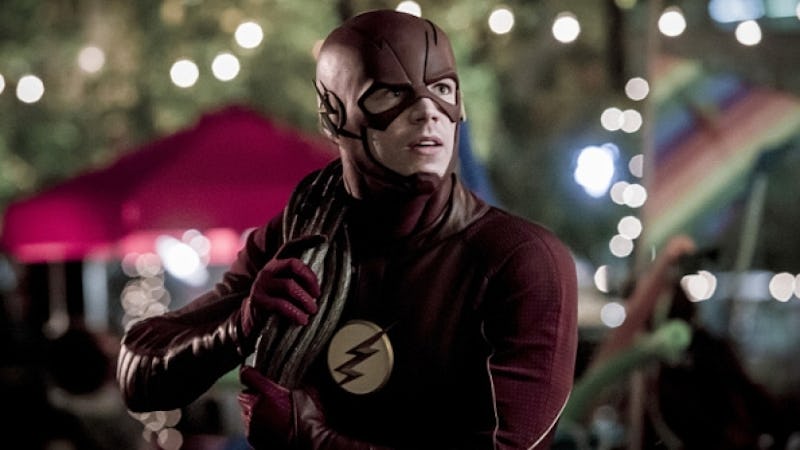 The Flash holding a rope and fighting a monster in season 3 episode 5