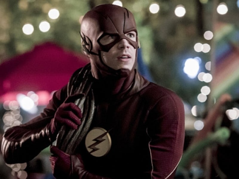 The Flash holding a rope and fighting a monster in season 3 episode 5