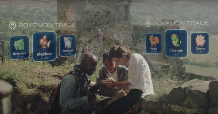 Three friends sitting and playing Pokémon GO