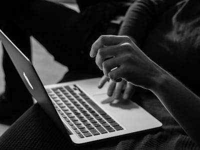 A woman setting VPN while using her laptop