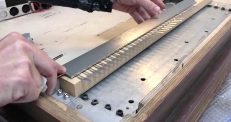 The video shows dozens of blades being placed inside the frame.