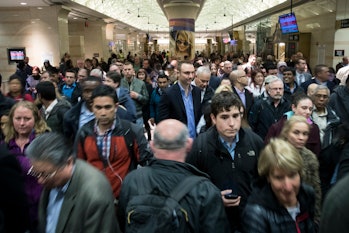 NEW YORK, NY - APRIL 4: Evening commuters make their way toward a New Jersey Transit train platform ...
