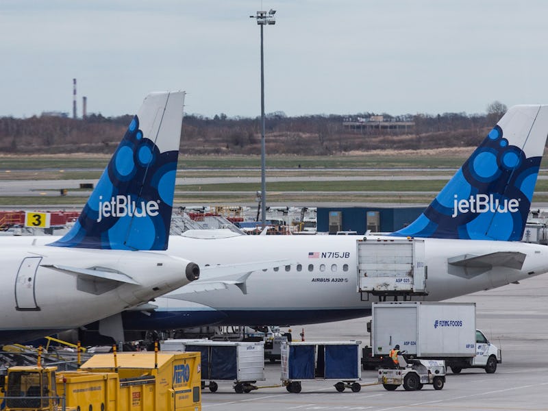Two JetBlue planes at an airport