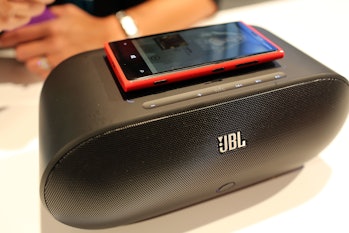 A Nokia Lumia 920 charging on top of a speaker at a 2012 event using inductive charging.