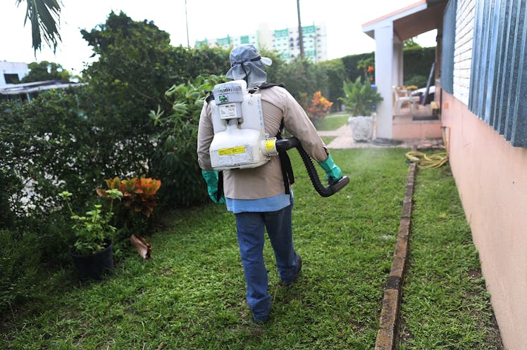 MIAMI, FL - OCTOBER 14: Joseph Blackman, a Miami-Dade County mosquito control inspector, uses a spra...