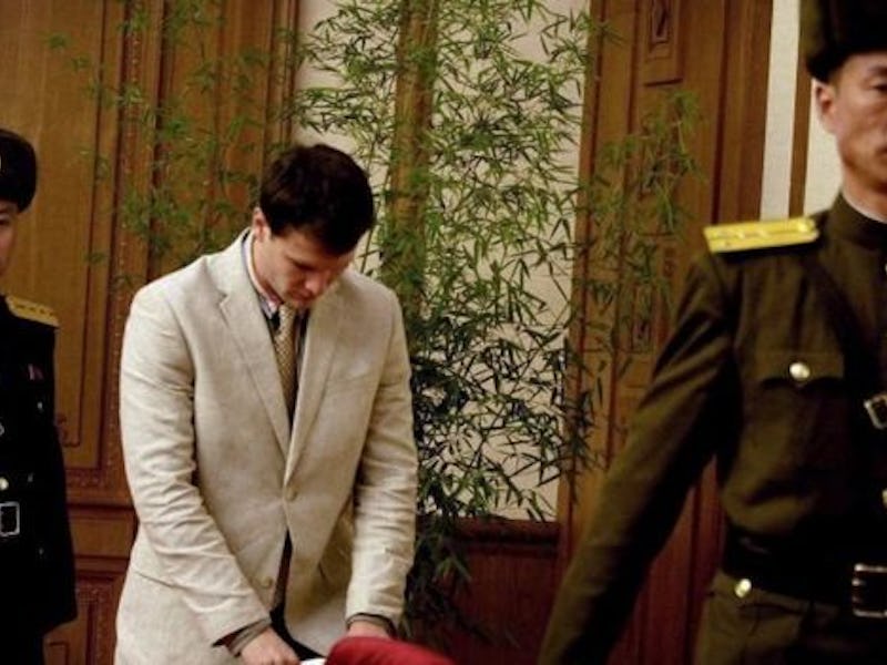 Otto Warmbier in a white suit during his arrest