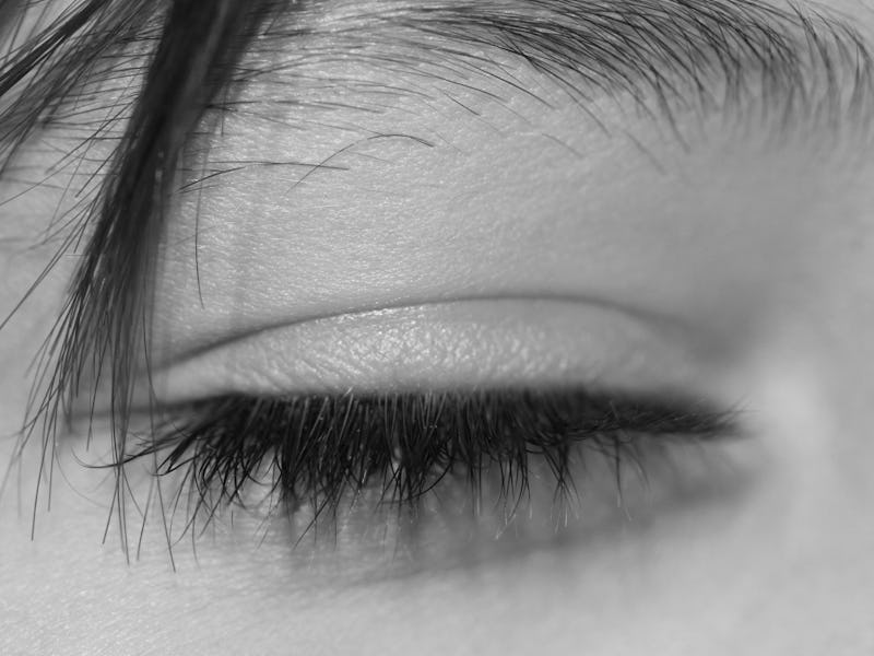A close-up of a blind woman's closed eye