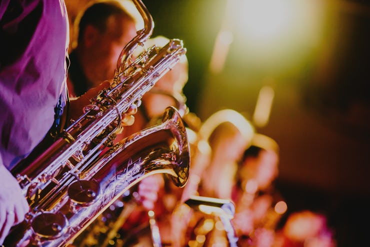 A closeup of a person playing a saxophone
