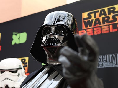 A man dressed up as Darth Vader from 'Star Wars' at a movie premiere
