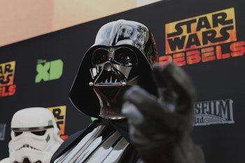A man dressed up as Darth Vader from 'Star Wars' at a movie premiere