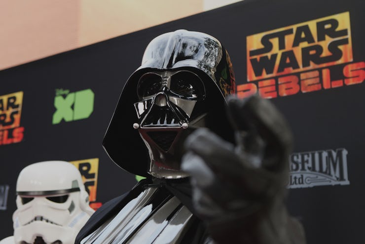 A man dressed up as Darth Vader from 'Star Wars' at a movie premiere
