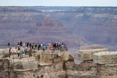 GRAND CANYON NATIONAL PARK, AR - JULY 14: Visitors stand at the Grand Canyon South Rim on July 14, 2...