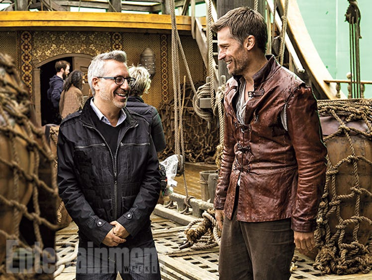 Actor Nikolaj Coster-Waldau standing next to a man on the "The Game of Thrones" set.