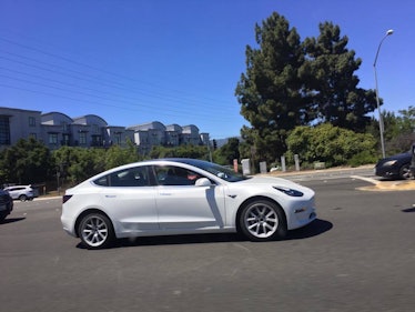 The white Model 3 in action.