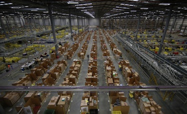 HEMEL HEMPSTEAD, ENGLAND - DECEMBER 05: Parcels are prepared for dispatch at Amazon's warehouse on D...