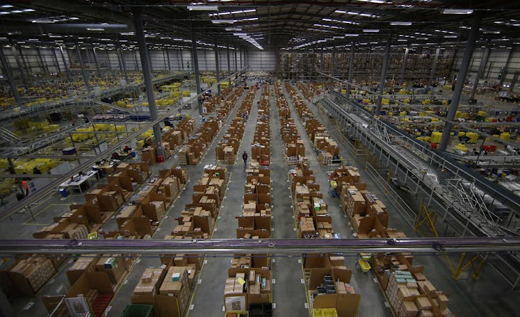 HEMEL HEMPSTEAD, ENGLAND - DECEMBER 05: Parcels are prepared for dispatch at Amazon's warehouse on D...