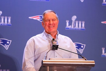 New England Patriots head coach Bill Belichick smiles as he is interviewed during the New England Pa...