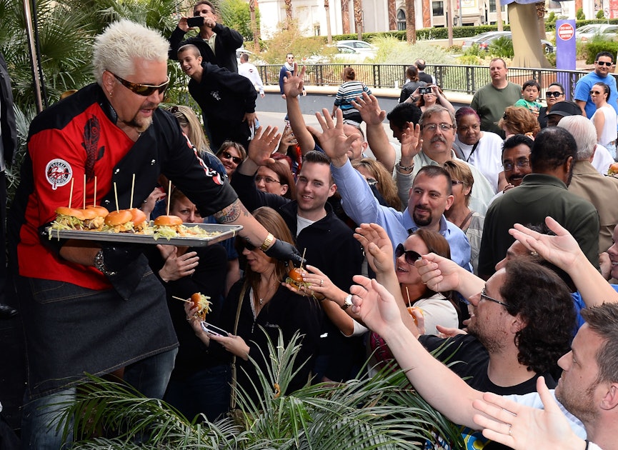 Chef And Television Personality Guy Fieri Serves Hamburgers To Guests During A Welcome Event For Guy ?w=1200&h=630&q=70&fit=crop&crop=faces&fm=jpg
