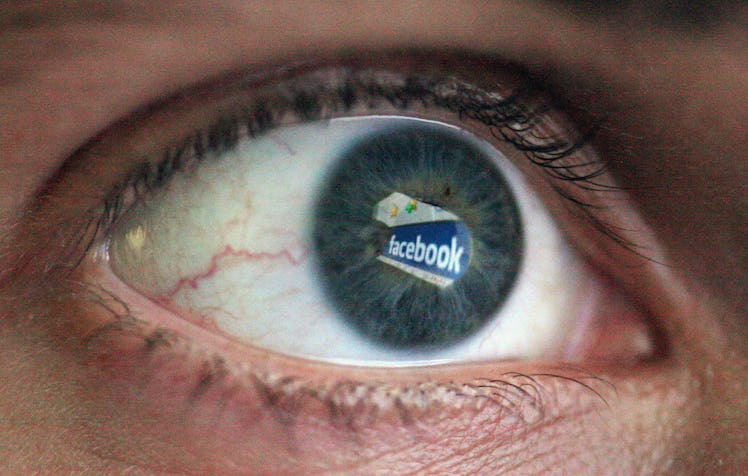 Up close picture of an eye in which "Facebook" is visible