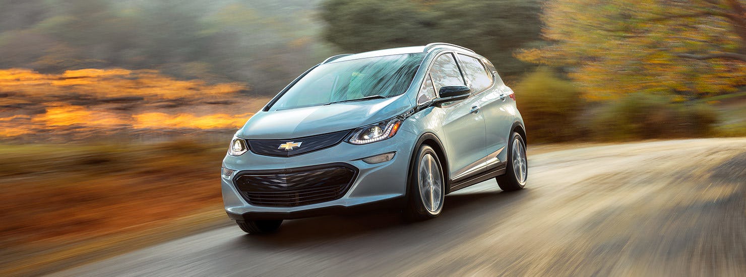 A grey Chevy Volt on a road