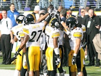 The Pittsburgh Steelers team assembling after a game