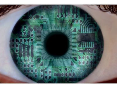 A close-up of a green-blue eye with a digital imprint effect representing cybersecurity