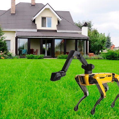 The Boston Dynamics Robot dog in yellow and black in front of a family house