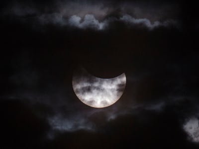 A moon eclipse with clouds that might not be visible for millions of Americans