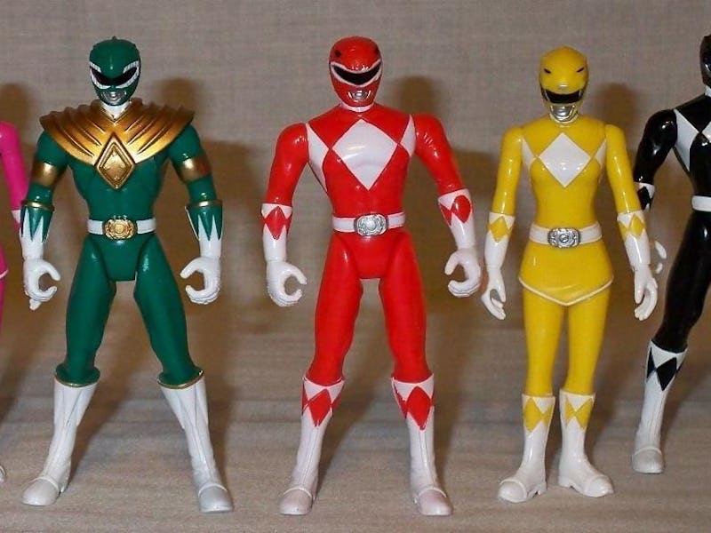 A blue, pink, green, red, yellow, and blue Power Rangers figure placed in a row