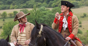 Josh Gad and Luke Evans riding horses as LeFou and Gaston in 'Beauty and the Beast'