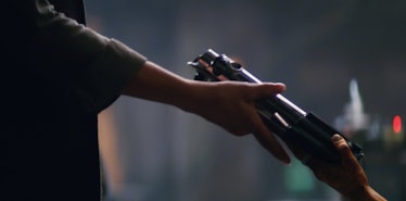 Maz hands Leia Luke's first lightsaber in the trailer for 'The Force Awakens.'