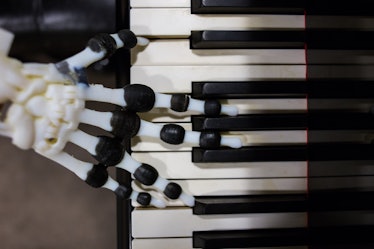 robot hand playing the piano