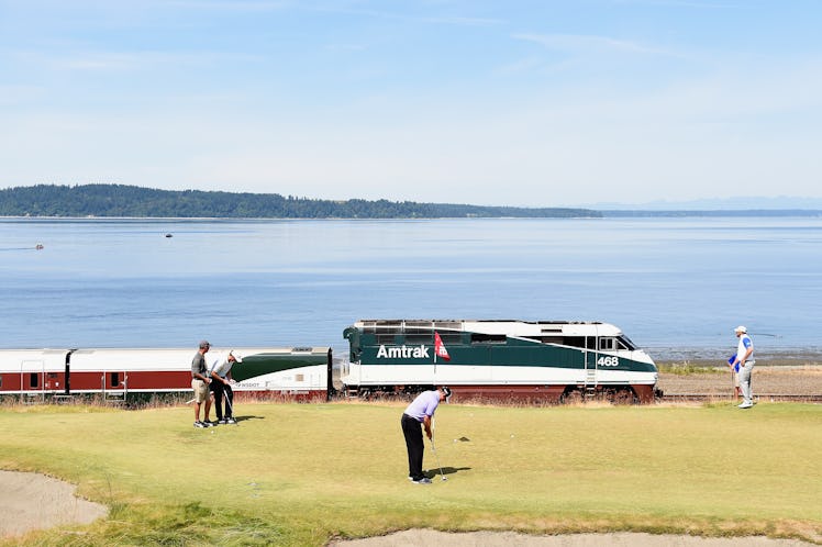 UNIVERSITY PLACE, WA - JUNE 15: An Amtrak train passes the 16th green during a practice round prior ...