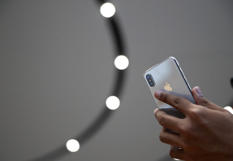 An attendee looks at a new iPhone X during an Apple special event at the Steve Jobs Theatre on the A...