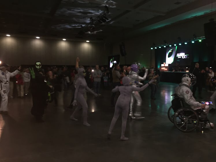 AlienCon cosplayers make they way to the stage for a costume contest.