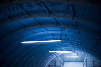 Mysterious lights inside what looks like a hangar.