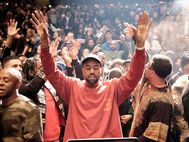 Kanye West in the middle of his audience crowd