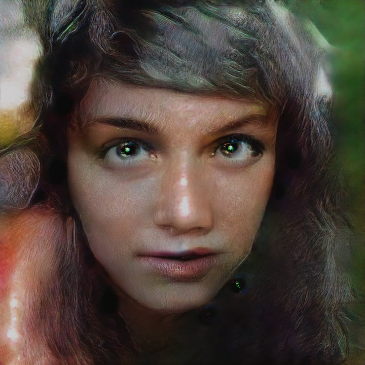 An AI generated face of a girl with brown hair and light brown eyes