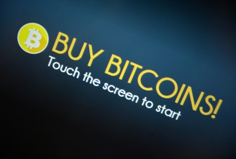"Buy Bitcoins" text sign and Bitcoin logo