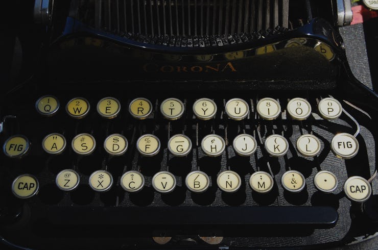 A close-up of the keyboard segment of an old typewriter machine