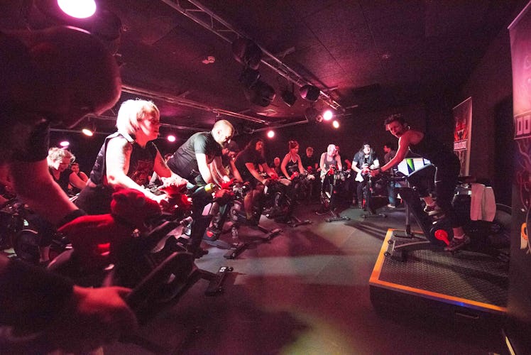 A lot of people working out at spin class