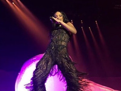 Rihanna in a black lace fringed bodysuit on stage during her ANTI tour