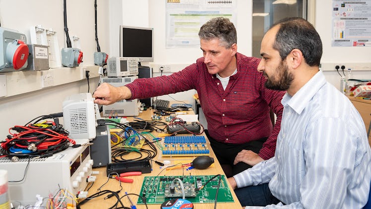 Prof Alain Nogaret and Dr Kamal Abu-Hassan in their lab.