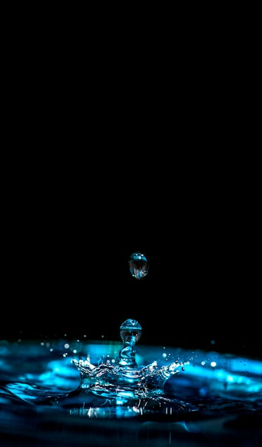 Drop of water falling in water